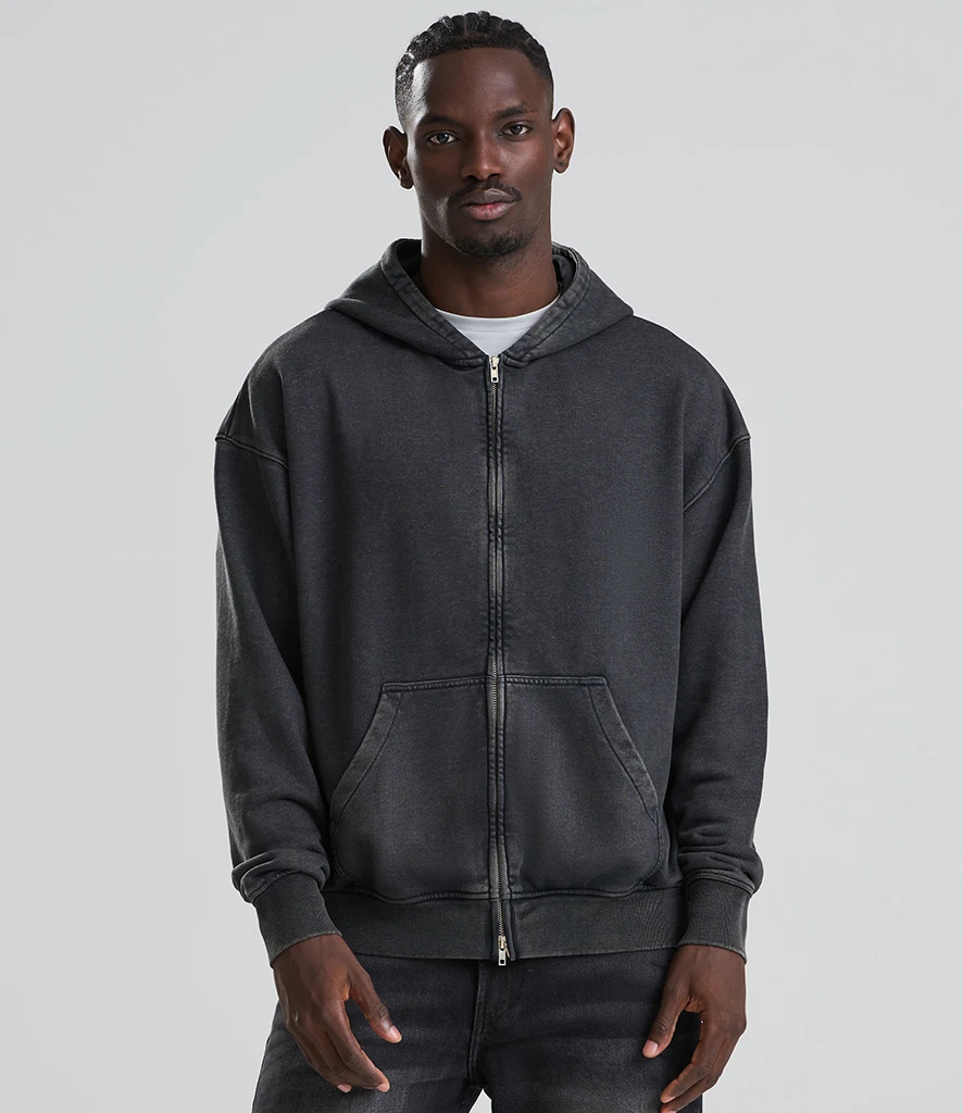 Man wearing Just Hoods blank washed black zipped hoodie 