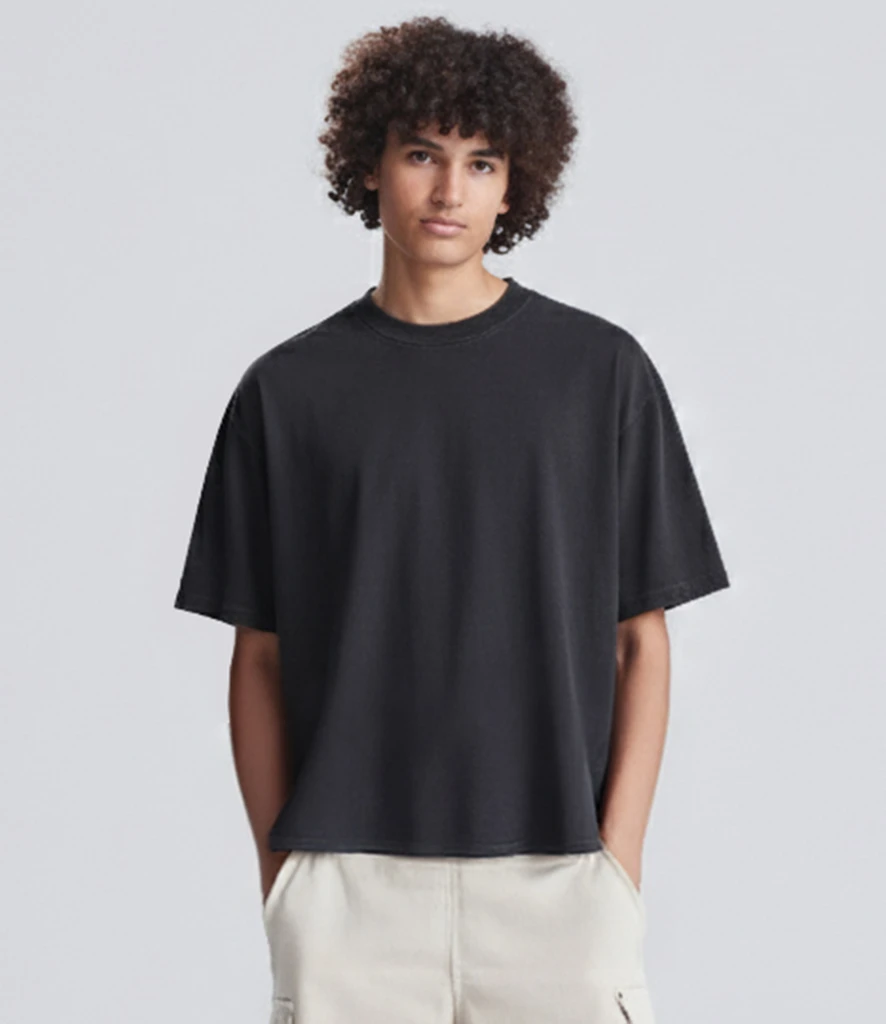 Man wearing boxy fit heavyweight t-shirt in washed black