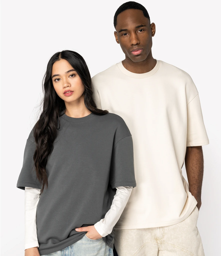Women and man wearing Native Spirit blank french terry t-shirts in grey and natural 