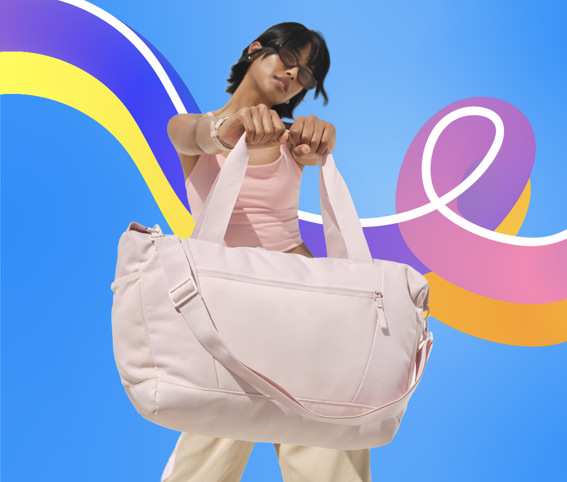 Women holding oversized pink tote bag
