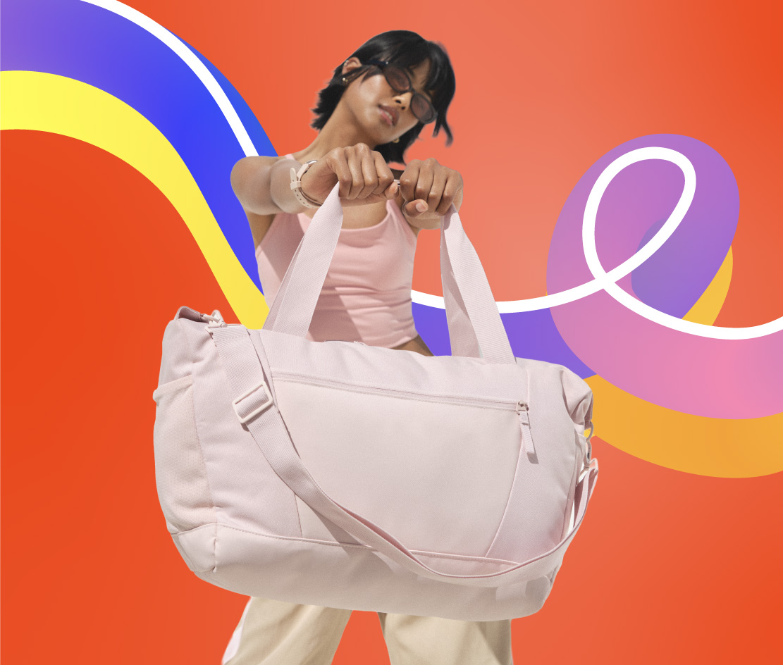 Women holding oversized pink tote bag