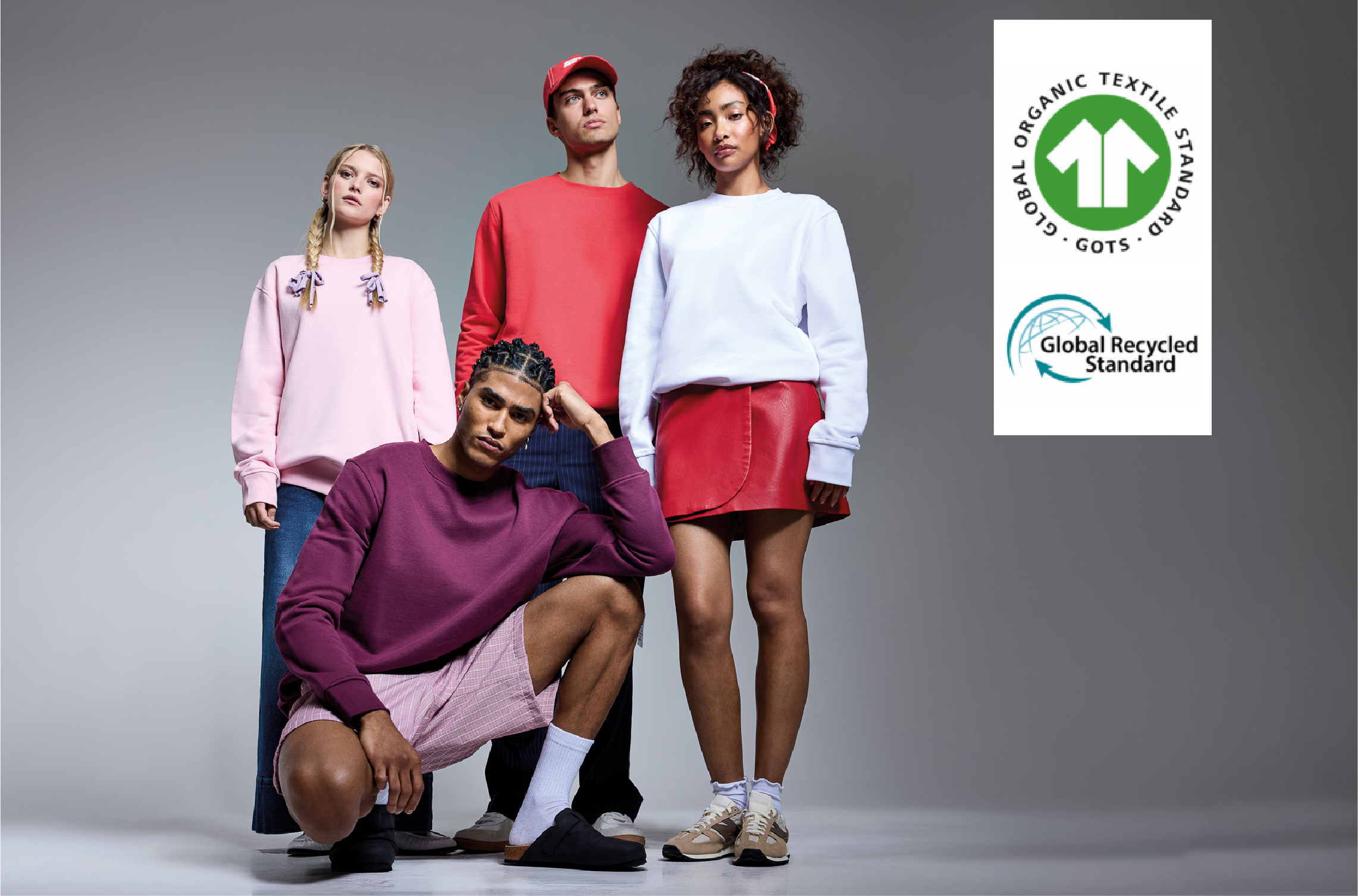 Group image of men and women wearing burgundy, pink, red and white sweatshirts
