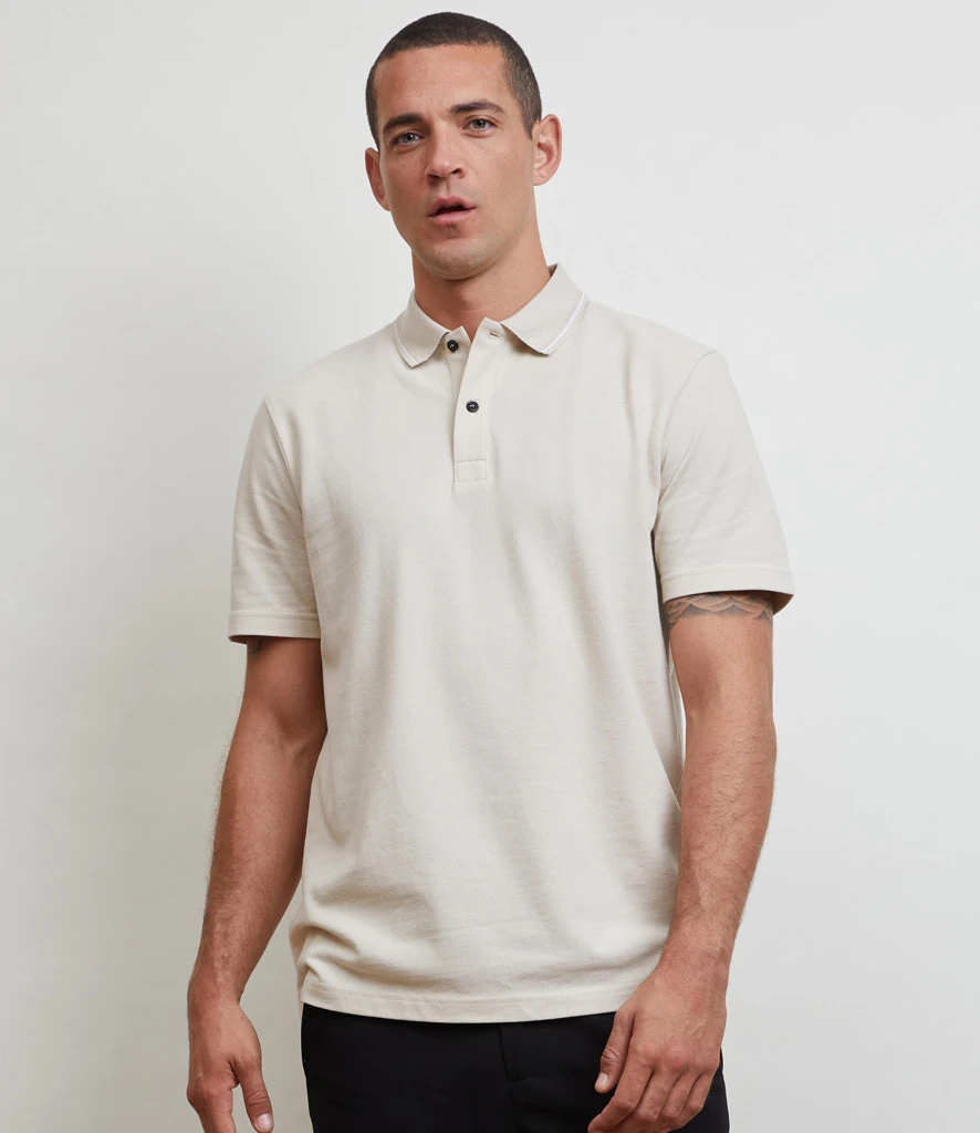 Man wearing natural NEOBLU unisex piqué polo shirt 