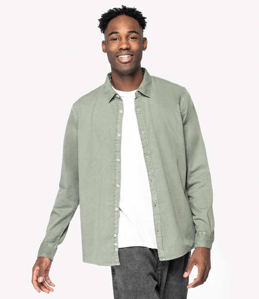 Man smiling wearing Native Spirit washed jade long sleeve shirt open 