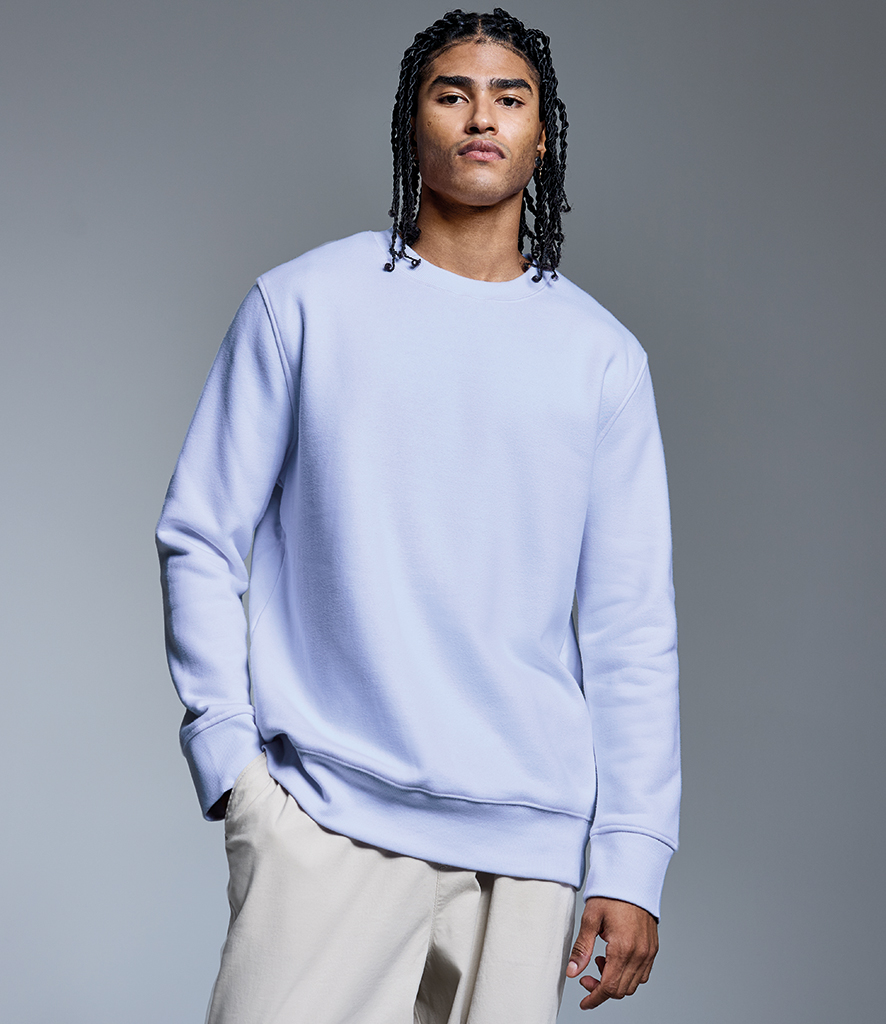 man wearing white Anthem organic sweatshirt