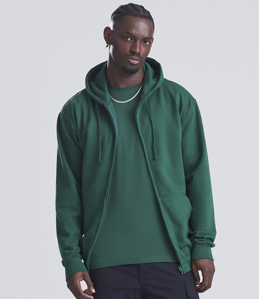man in bottle green zip up hoodie