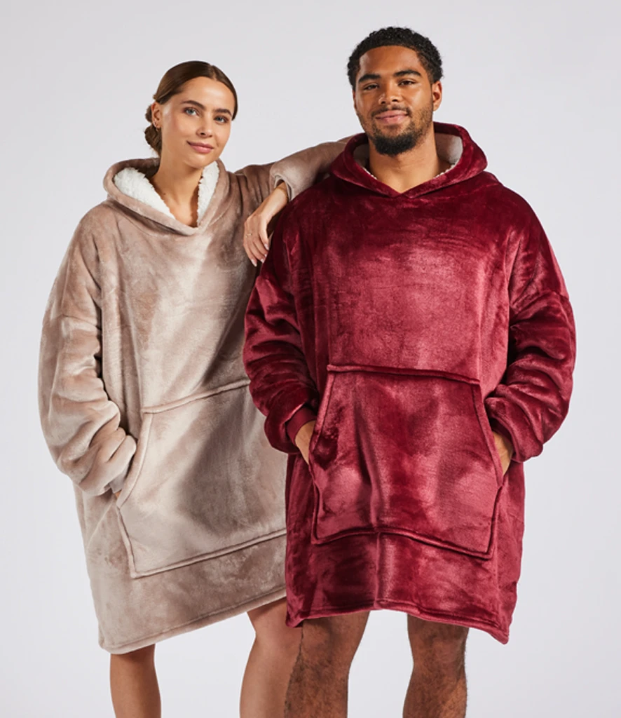 Man and women wearing fluffy oversized hoodied blankets - oodie
