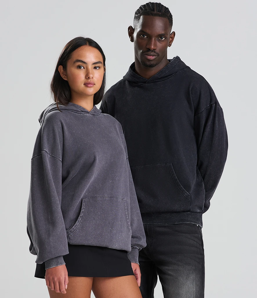 Women and man wearing Just Hoods oversized blank hoodie in washed colour ways 