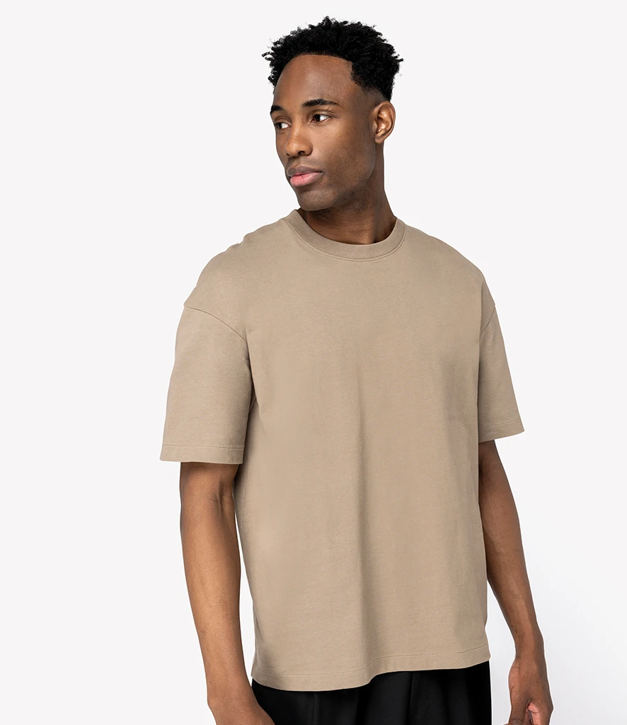 Man wearing oversized fit 100% organic cotton Native Spirit t-shirt in driftwood brown