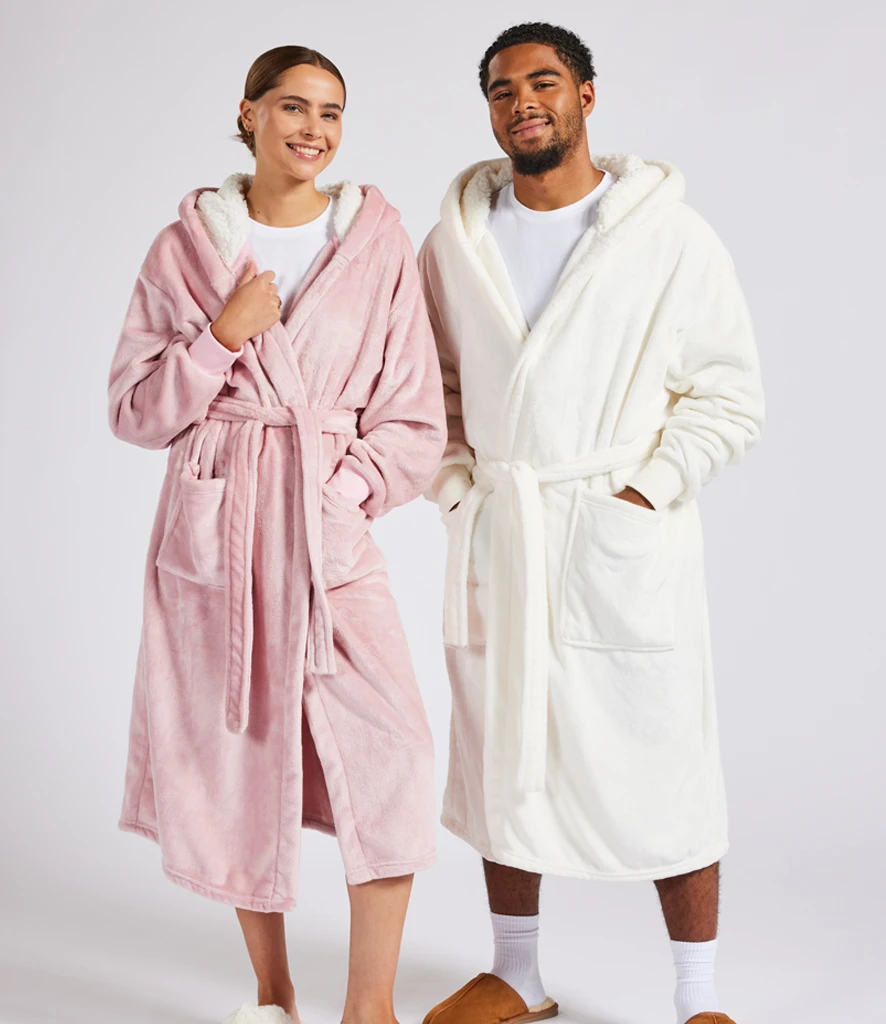 Man and women wearing unisex hooded robe in pink and cream