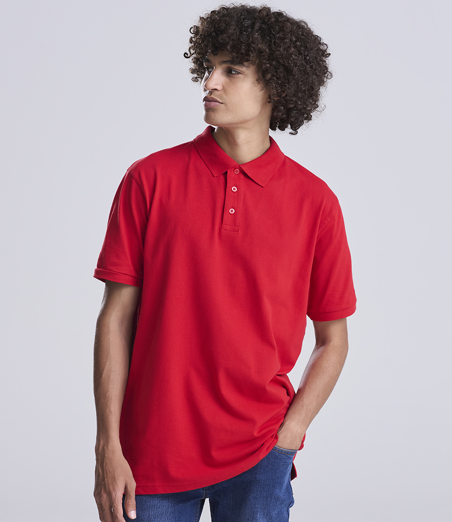 man in red polo shirt by awdis polos hand in pocket
